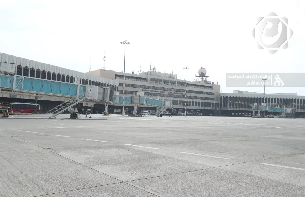 إدارة مطار بغداد الدولي تنفي إزالة صورة الشهيد المهندس